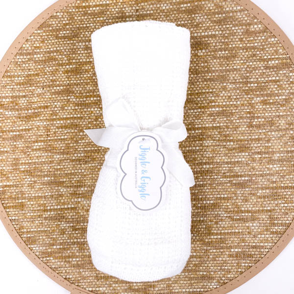white cotton baby blanket
