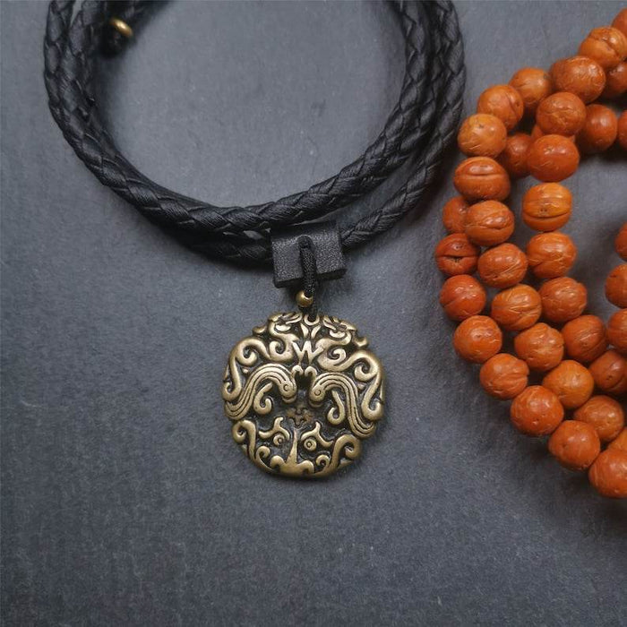 Kirtimukha Pendant,Dragon Badge - Tibetan Buddhist art, close-up detail