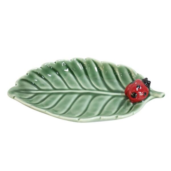 Green leaf-shaped ceramic plate with a red ladybug