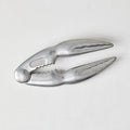 Laguiole Jean Dubost aluminum seafood crab cracker, claw-shaped, 5.5"L, with "FRANCE" embossed.