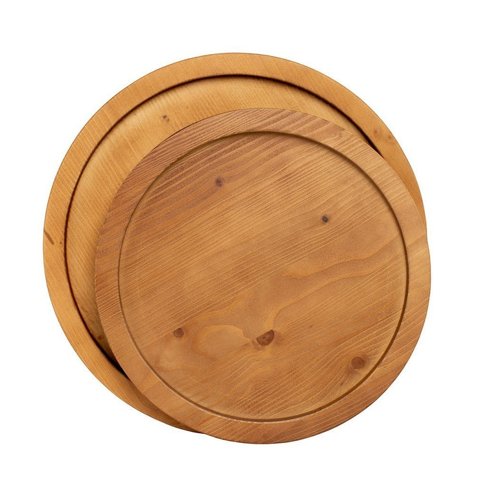Two round natural reclaimed pine wood serving trays, one large and one small, stacked.