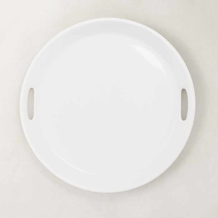 Creamy white ceramic round serving tray with integrated handles, 16.5" diameter.