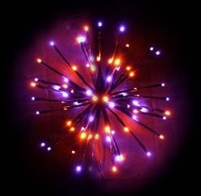 Certified Lights LED Spritzer burst light with purple and orange twinkling and steady LEDs.