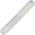 White satin table runner with scalloped edges, embroidered with yellow chicks, Easter eggs, and spring daisies.