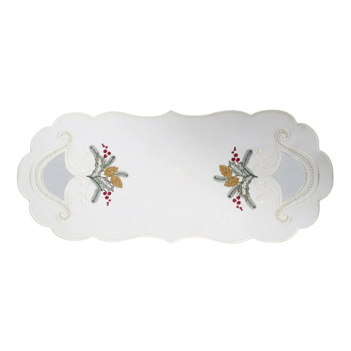 White linen table runner with embroidered candle and holly design and decorative sheer cutout details