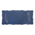 Blue linen table runner with scalloped edges and delicate winter embroidery design on both ends