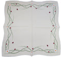 White square linen tablecloth with daisy and ladybug embroidery along the border with green stems