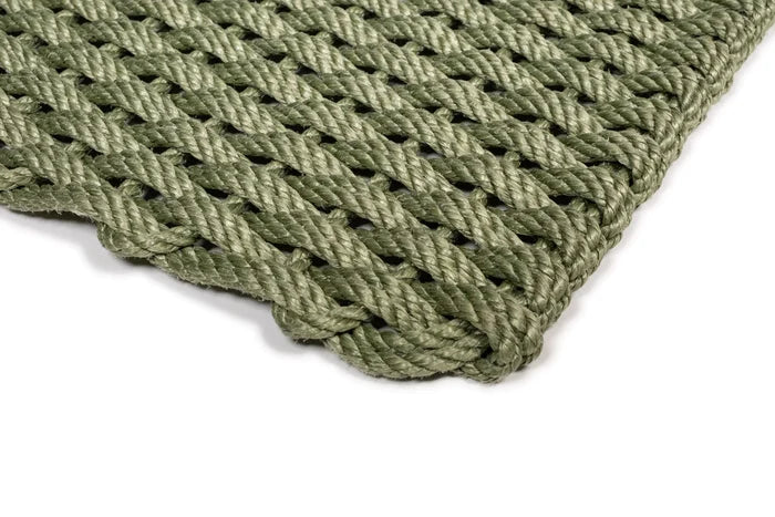 Handwoven Loden Green Rope Doormat with a tight, braided weave and rounded corner.