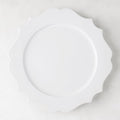 White 11" Lungarno ceramic dinner plate with sculptural, scalloped edges.