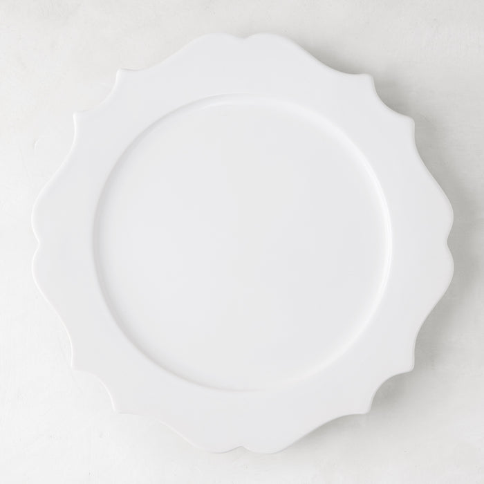 White 11" Lungarno ceramic dinner plate with sculptural, scalloped edges.
