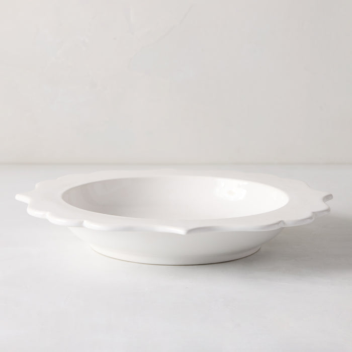White ceramic Lungarno soup bowl with sculptural, scalloped rim.