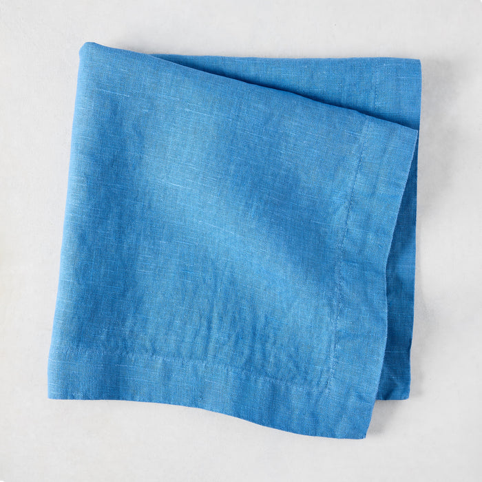 Lupine Blue HG Signature hand-dyed linen napkin, folded, 22-inch square.