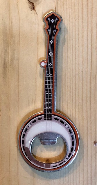 Magnetic metal bottle opener in the shape of a banjo with intricate detail on front.
