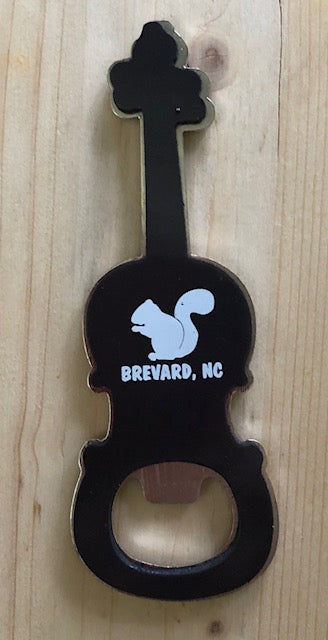Bottle opener in the shape of a fiddle with a white squirrel and Brevard, NC on it. Back