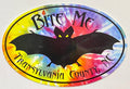 A magnet with a large black bat silhouette on a tie-dye background with the text 'Bite Me Transylvania County, NC'.