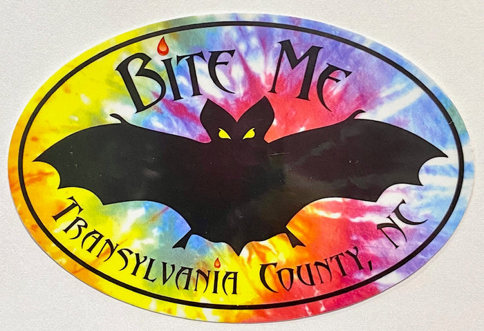 A magnet with a large black bat silhouette on a tie-dye background with the text 'Bite Me Transylvania County, NC'.