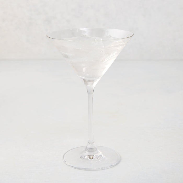 Clear glass Midtown Martini Glass, 8.5"H, filled with ice and a clear drink.