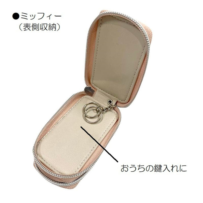 Miffy Key Case with zip-around design, featuring a chain with two key rings and a flat pocket for storing keys, suitable for attaching to a bag.
