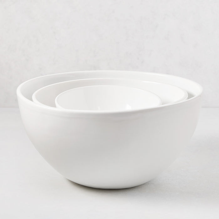 Three nested HG Modern white ceramic serve bowls, sleek and simple.