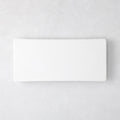 Modern rectangular white ceramic serving platter, 14.75"L x 6.75"W, with clean lines and low profile.