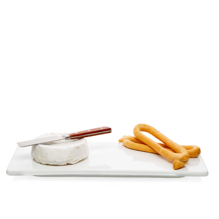 White rectangular ceramic serving platter with cheese, knife, and breadsticks.