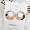 Pair of layered earrings on a Moe Moe branded card