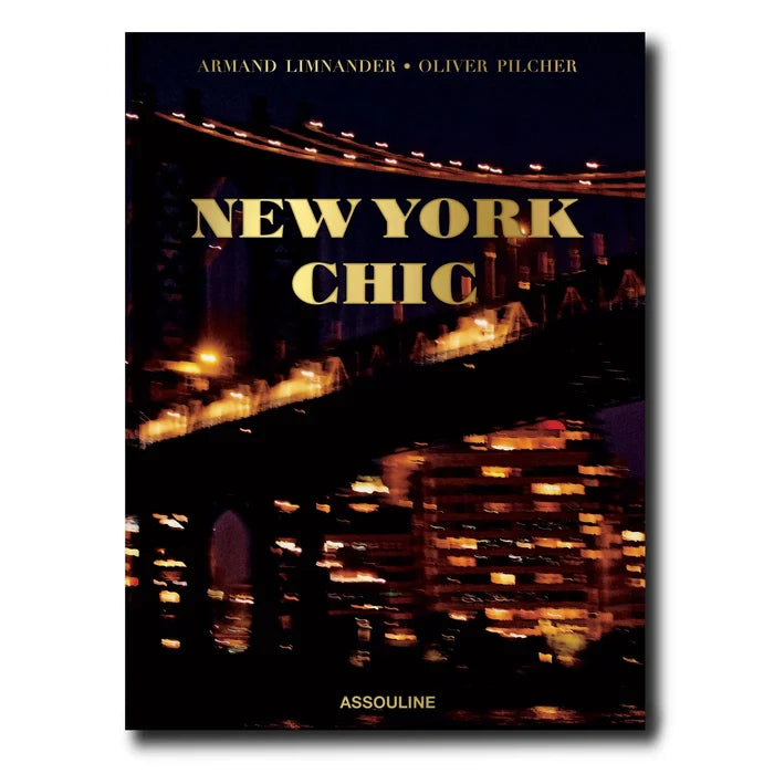 New York Chic" silk hardcover book with gold title over a blurred night city bridge scene.