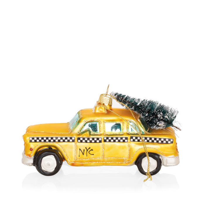 5-inch mouth-blown glass NYC taxi cab Christmas ornament with glitter and a miniature pine tree on the roof.