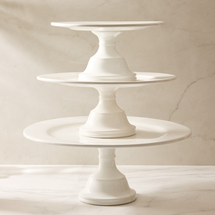 Three HG Original creamy white ceramic pedestal cake stands, stacked.