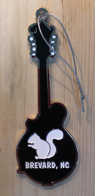 Metal mandoline shaped ornament with our white squirrel and 'Brevard, NC' on it.