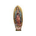 Sculpted wooden statue of Our Lady of Guadalupe, with rays of light shining behind her, and a cherub and a crescent moon at the base.