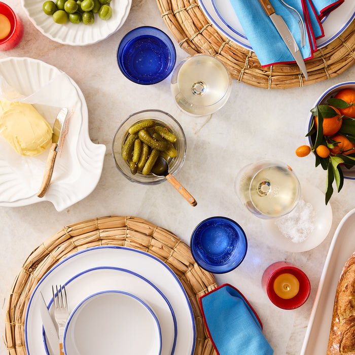 Pacific Blue-Rimmed Stoneware Dinner Plate with hand-painted blue edge and irregular shape.