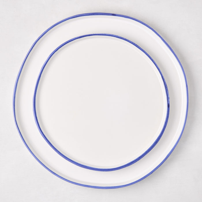 Pacific Blue-Rimmed Stoneware Dinner Plate, 11" diameter, with hand-painted blue edge and irregular shape.