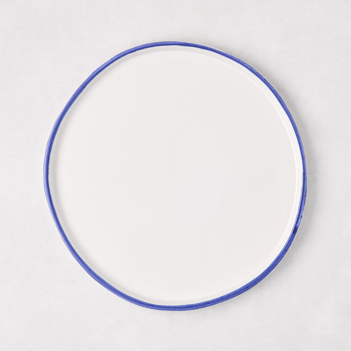 Pacific Blue-Rimmed Stoneware Salad Plate, 8" diameter, with hand-painted blue edge and irregular shape.