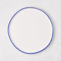 Pacific Blue-Rimmed Stoneware Salad Plate, 8" diameter, with hand-painted blue edge and irregular shape.