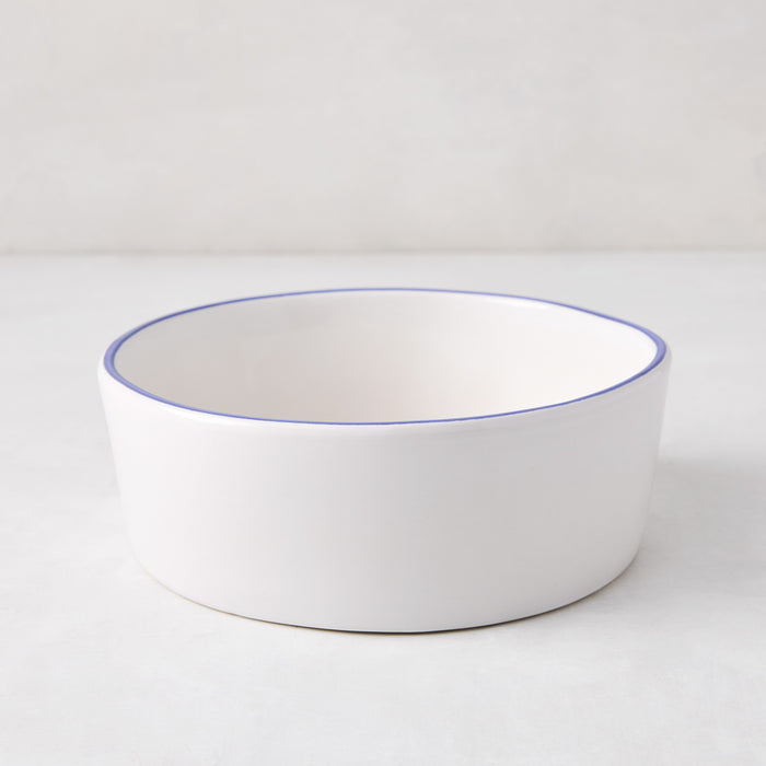 Pacific Blue-Rimmed Stoneware Soup Bowl, 6" diameter, white with hand-painted blue edge, irregular shape.