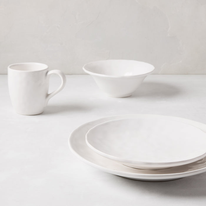 Pebble White ceramic dinner plate, salad plate, bowl, and mug with subtle textures.
