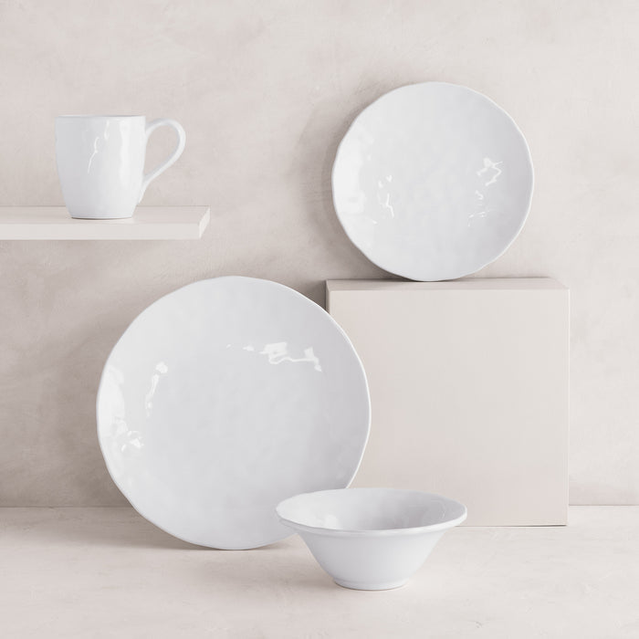 Pebble White ceramic dinner plate, salad plate, bowl, and mug with subtle textures.