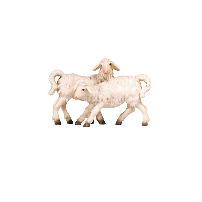 Hand-carved PEMA Kostner nativity group of two white lambs playing together, made from sycamore maple and oil-painted, crafted in Val Gardena, Italy.