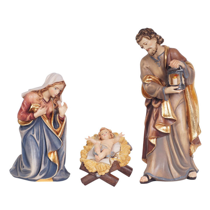 Hand-carved PEMA Kostner Holy Family with Mary kneeling, Joseph standing with lantern, and Infant Jesus removable from a straw-lined manger, crafted in Val Gardena, Italy.