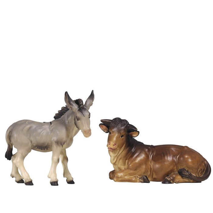 Hand-carved PEMA Kostner nativity ox lying down and donkey standing, made from sycamore maple and oil-painted, crafted in Val Gardena, Italy.