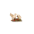 Hand-carved PEMA Kostner nativity pair of white doves, one standing and one sitting, resting on twigs with red berries and green leaves, crafted in Val Gardena, Italy.