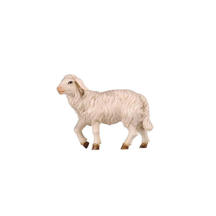 Hand-carved PEMA Kostner nativity sheep standing with head raised, made from sycamore maple wood and oil-painted in white tones, crafted in Val Gardena, Italy.