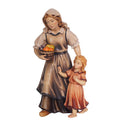 Hand-carved PEMA Kostner nativity shepherdess holding a fruit basket with young girl at her side, made from sycamore maple wood and oil-painted, crafted in Val Gardena, Italy.