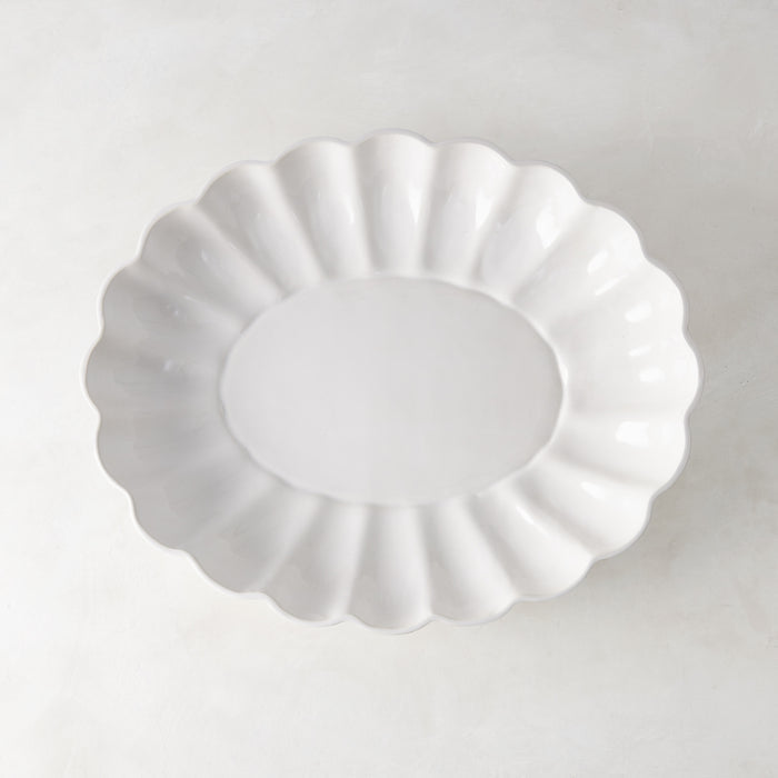 White Petal Large Oval Ceramic Serve Bowl with scalloped edges and glazed finish.