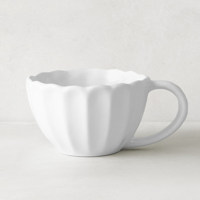 White Petal Stoneware Mug, 11.83oz, with rounded edges and vintage-inspired scalloped design.