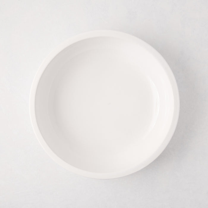 White ceramic Piatto Riso Small Serve Bowl, 11.75"Dia x 3"H, with a simple, sleek design.