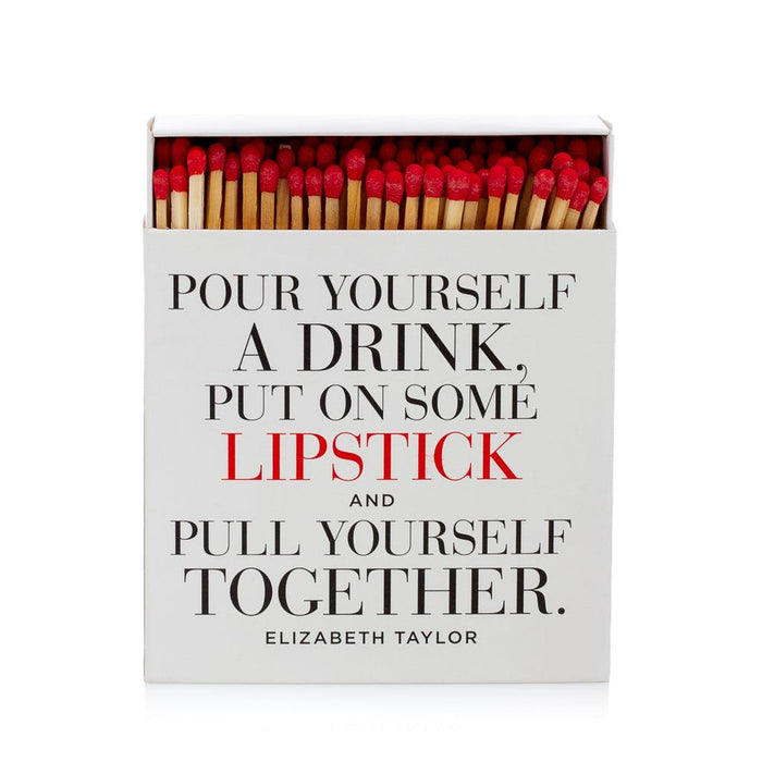 White boxed matches with "Pour Yourself a Drink, Put on Some Lipstick..." quote, red match tips visible.