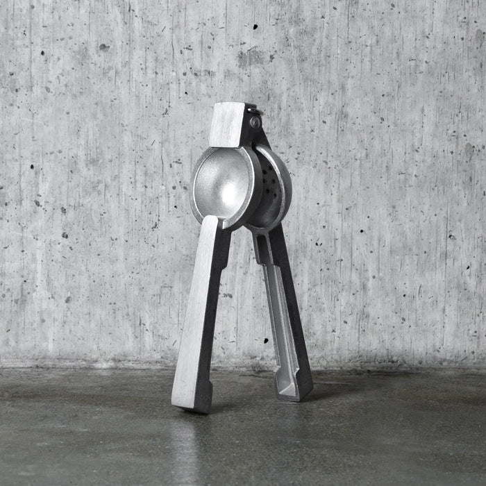 Professional silver aluminum citrus juicer, 9''H x 3''W, with polished finish.