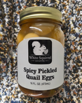 "Homemade spicy pickled quail eggs in 16oz jar with White Squirrel Shoppe label, Brevard NC"